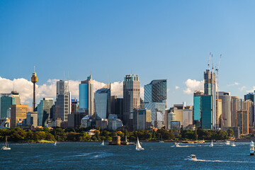 Fototapeta premium Beautiful panorama of Sydney city skyline viewed across the harbour from the Taronga Zoo Wharf on a bright day