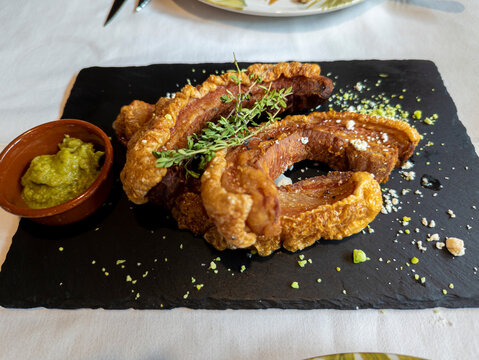Typical Spanish dish called torreznos, consisting of deep-fried pork skin and savory fried crust