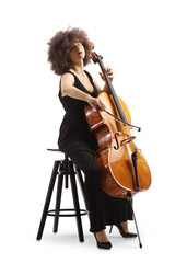 Woman in a black dress sitting on a chair and playing a cello