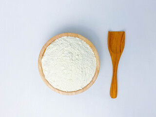 A wooden bowl of flour.