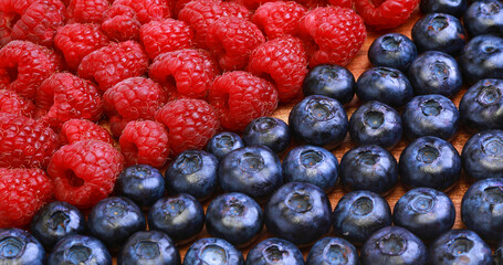 Raspberries and blueberries. Top view. Close-up.