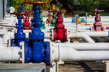 Fototapeta na wymiar Pump motor oil and pipeline pressure gauge valves at plant pressure safety valve
