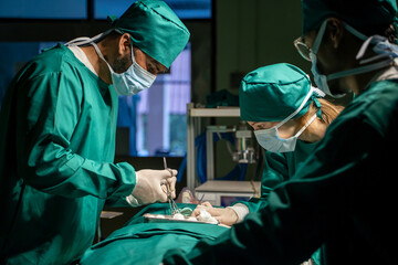 Female surgeon team and male surgeon ready to operate on patients in hospital operating room.