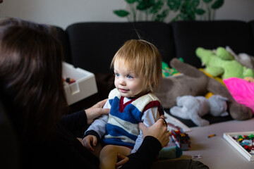 Cute blond baby with blue eyes. High quality photo