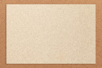Fototapeta premium Texture of craft light beige color paper background with brown border, macro. Vintage kraft sand cardboard