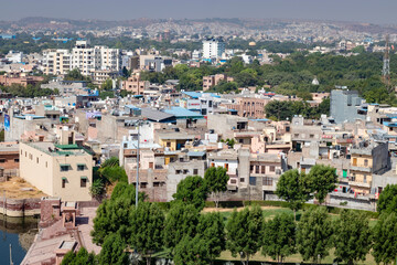 Fototapeta na wymiar cityscape view of crowded town at morning from flat angle with flat sky