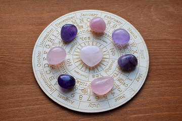 Gemstones for zodiac signs, amethysts and rose quartz on the zodiac chart. Predictions, witchcraft,...