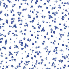 Cute floral pattern. Seamless vector texture. An elegant template for fashionable prints. Print with small blue flowers and leaves. white background.