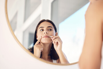 Beauty, mirror and tweezers with a woman in the bathroom of her home for hair removal or skincare....