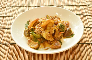 stir fried spicy wild boar and eggplant with red curry on plate