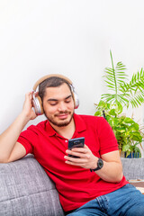 Fototapeta premium Man smile listening music at home.
