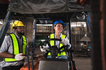 Portrait happy Latin America woman engineer drive forklift truck at factory  © chachamp
