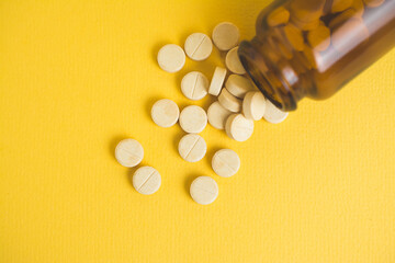 headache pills isolated on yellow