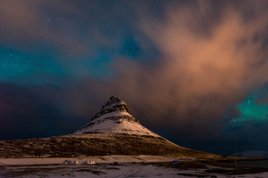 Northern lights in Iceland with distinctly shaped mountain on foreground