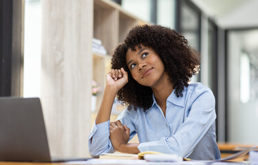 Successful african american accountant business woman work documents tax on laptop computer in office. finance investment economy and marketing research concept.