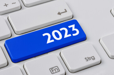  A keyboard with a blue button - 2023
