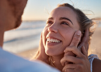 Face in hands, couple and love with trust and care, travel to beach on romantic vacation for...