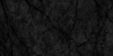 Ancient and grainy Black Emperador marble texture with various cracks, dusty and cracked old wall texture, dark black and grainy Concrete floor or old grunge, old blackboard or chalkboard texture.