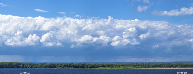 White clouds in the sky - the Volga river