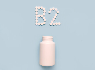 Vitamin B2 , riboflavin, icon from tablets and drug bottle on blue background. Colltction of vitamin and minerals