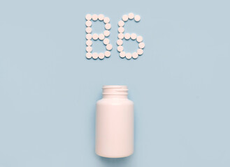 Vitamin B6, Pyridoxine, icon from tablets and drug bottle on blue background. Colltction of vitamin and minerals
