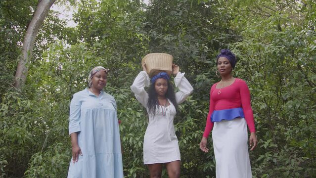 Haitian women in nature with fruit basket