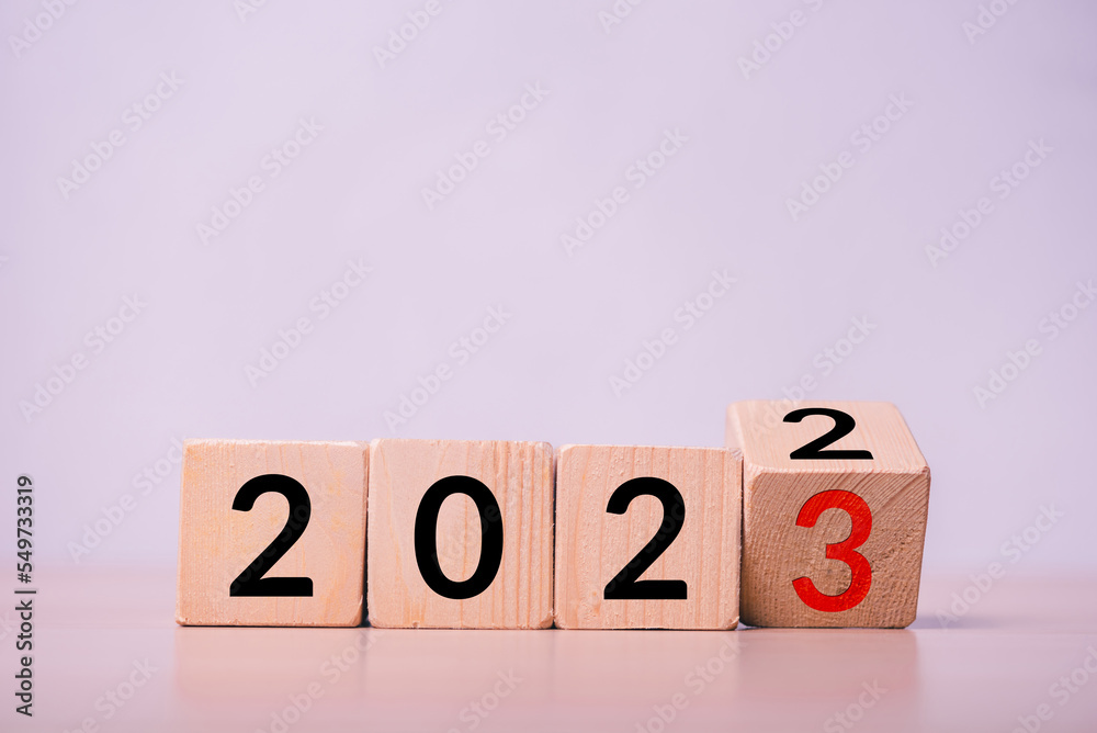 Aufkleber row of wood cube with text new year change from 2022 to 2023