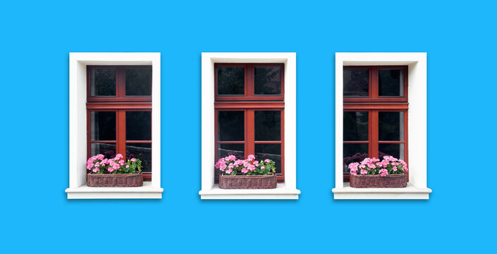 Windows with flower box. Italian architecture background. Vibrant color blue wall facade. Small town house exterior. Street of European city building. Three window frames isolated on empty wall.