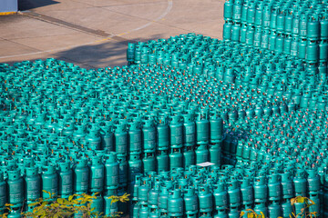 Obraz premium LPG stock tank gas bottle stack ready for sale