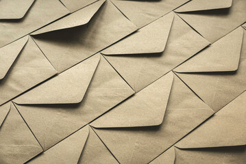 A row of brown craft envelopes as a background.