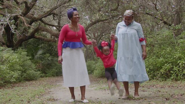 Women playing with child at the park