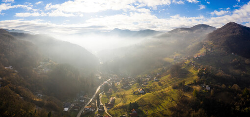 Aerial view of scenic sunset over village at Zumberak mountain range, Croatia.