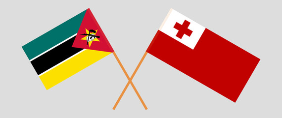 Crossed flags of Mozambique and Tonga. Official colors. Correct proportion