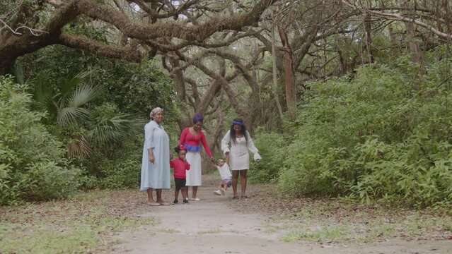 Woman walking in park with their children
