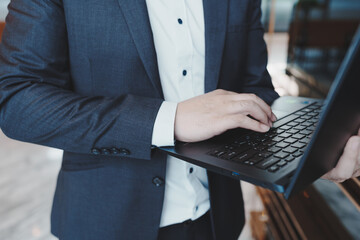 Close up of young business man and digital number of stock market background to represent successful in investment marketing. Find out the best solution in business and financial as concept.