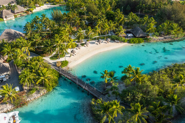 Moorea, French Polynesia - 14 November 2022: Aerial view of boats docked at the pier in Bora Bora Four Season luxury resort, French Polynesia.