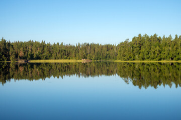 Fototapeta na wymiar landscape with reflection on the forest lake