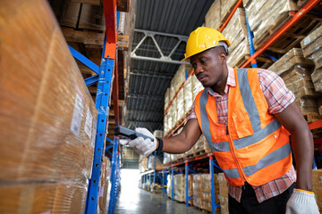 African american warehouse worker use bar code reader scanning packages at storage compartment.