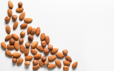 Nuts almonds and hazelnuts on a white background. copy space