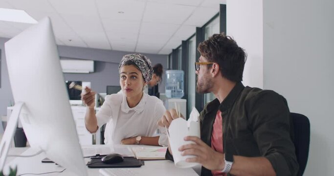 Business people, lunch and computer while planning, strategy and working on marketing and advertising project online. Diversity, muslim woman and man with pc, teamwork and collaboration for design
