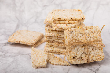 Rice bread on a marble background. Rice cakes. Diet bread on the table.Healthy food without yeast.Place for text. Place to copy. Healthy food. dietary product.