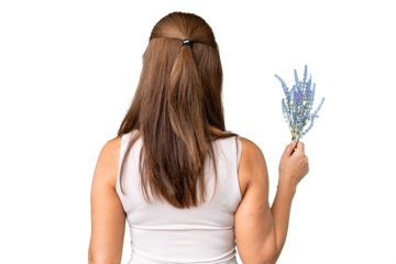 Middle age caucasian woman holding lavender over isolated background in back position