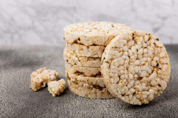 Rice cakes on a black table. Bread. Airy rice bread. dietary crispy round rice cakes. Place for text. Place to copy. Healthy food. dietary product.