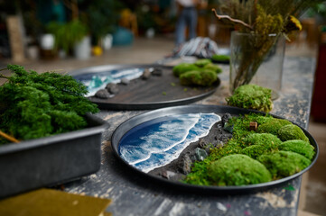 Artist workplace with beautiful board made of moss and epoxy resin