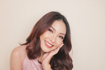 Fototapeta premium Close-up beauty face of Asian young model touching clean skin. Natural nude make-up. Skincare beauty facial treatment, spa, female health concept.