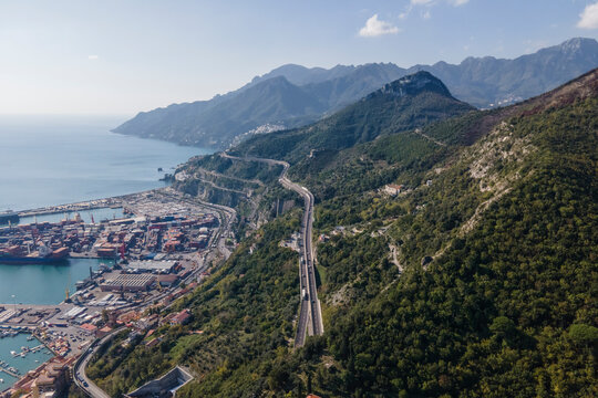 Aerial view of the highway along the coastline with mountains in Salerno, Campania, Italy.