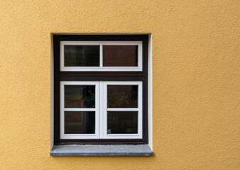 yellow home wall and one window.
