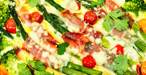 Casserole with asparagus and bacon, close up