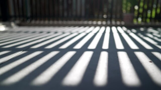 Sunlight patterns on floor at balcony terrace. Beautiful day light