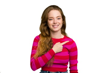 Young caucasian redhead woman isolated smiling and pointing aside, showing something at blank space.